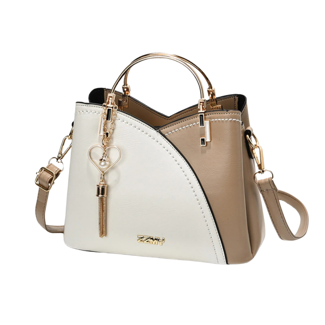 Stylish women's patchwork tote bag with a chic tassel charm. Perfect shoulder bag for everyday fashion.