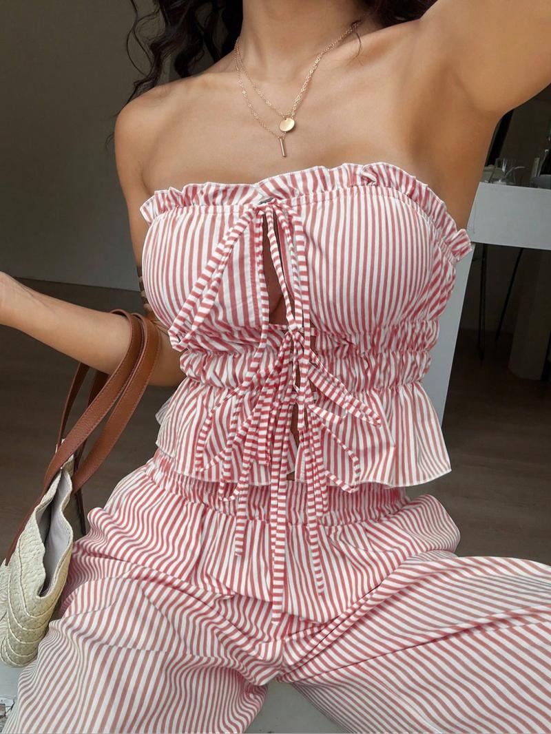 Stylish women's pinstripe bandeau top and wide-leg pants set. Perfect for summer casual or resort wear.