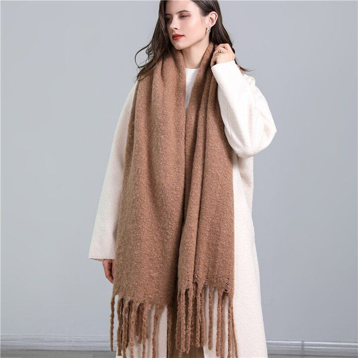 Women's stylish winter scarf, featuring a classic plaid pattern.
