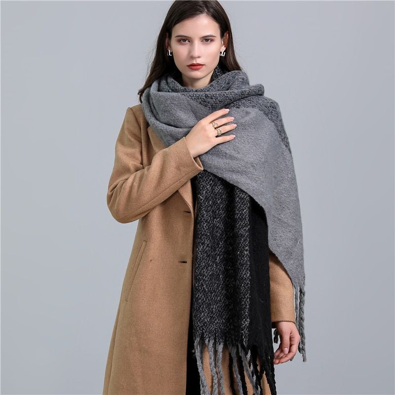 Warm women's checked scarf, a cozy plaid winter fashion accessory.