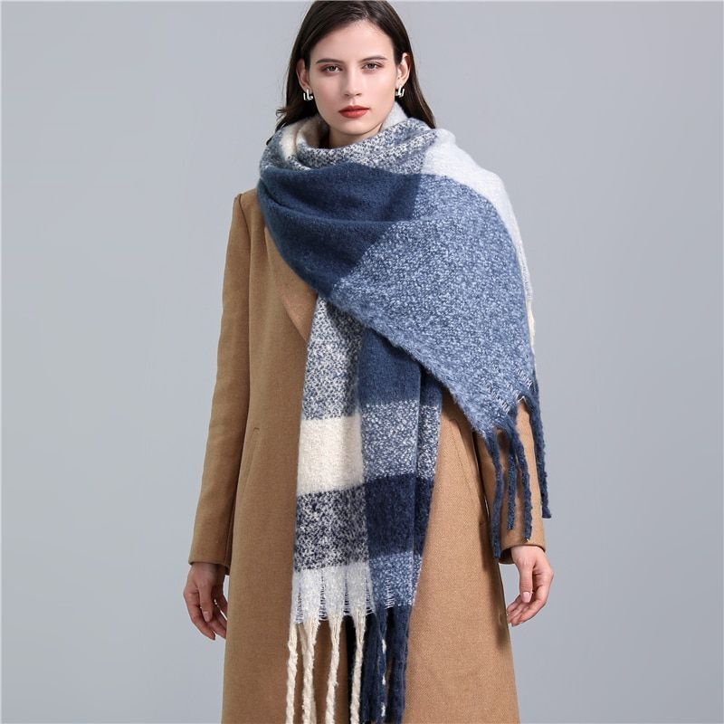 Cozy women's winter plaid scarf, perfect for cold weather fashion.
