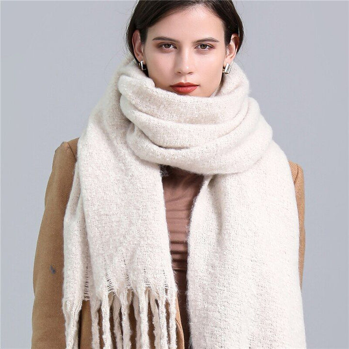 Women's checked winter scarf, stylish plaid design for warmth.