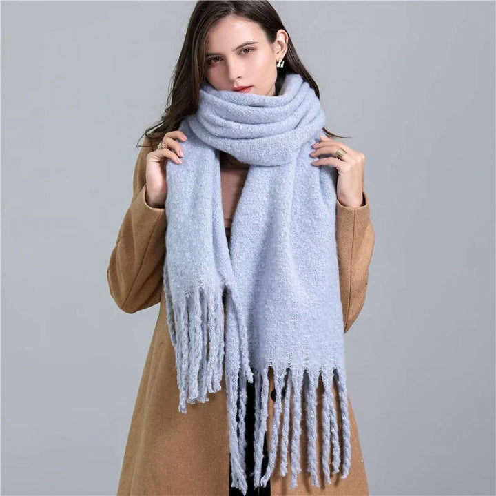 Trendy women's plaid winter scarf, perfect cozy fashion accessory.