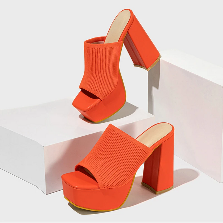 Stylish women's platform sandals with elevated sole, offering comfort and trendy fashion for summer wear.