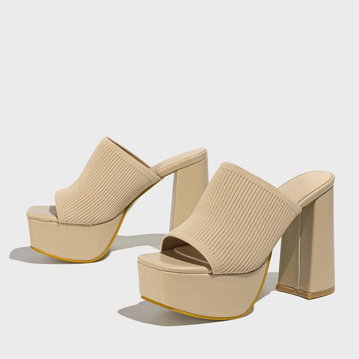 Elegant women's platform sandals, perfect for dressy or casual occasions, featuring a comfortable elevated sole.