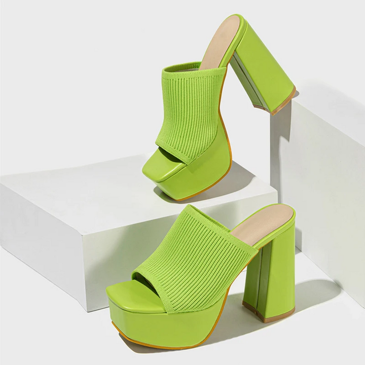 Chic black women's platform sandals with a comfortable elevated sole, ideal for stylish summer outfits.