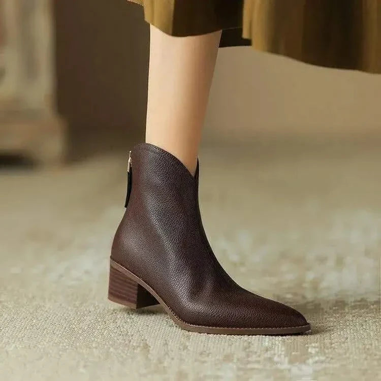 Stylish women's pointed toe ankle boots with a comfortable heel, perfect for everyday chic.
