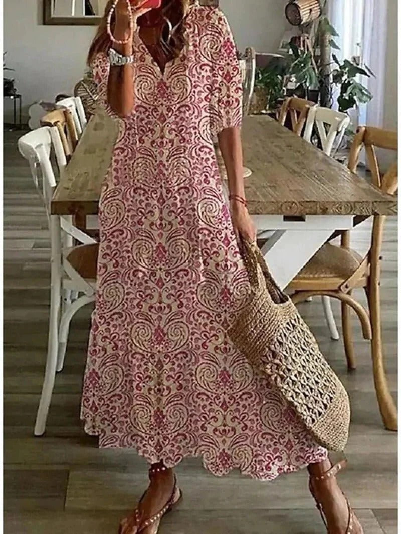 Stylish women's printed summer midi dress with half sleeves, perfect for casual wear or vacation.