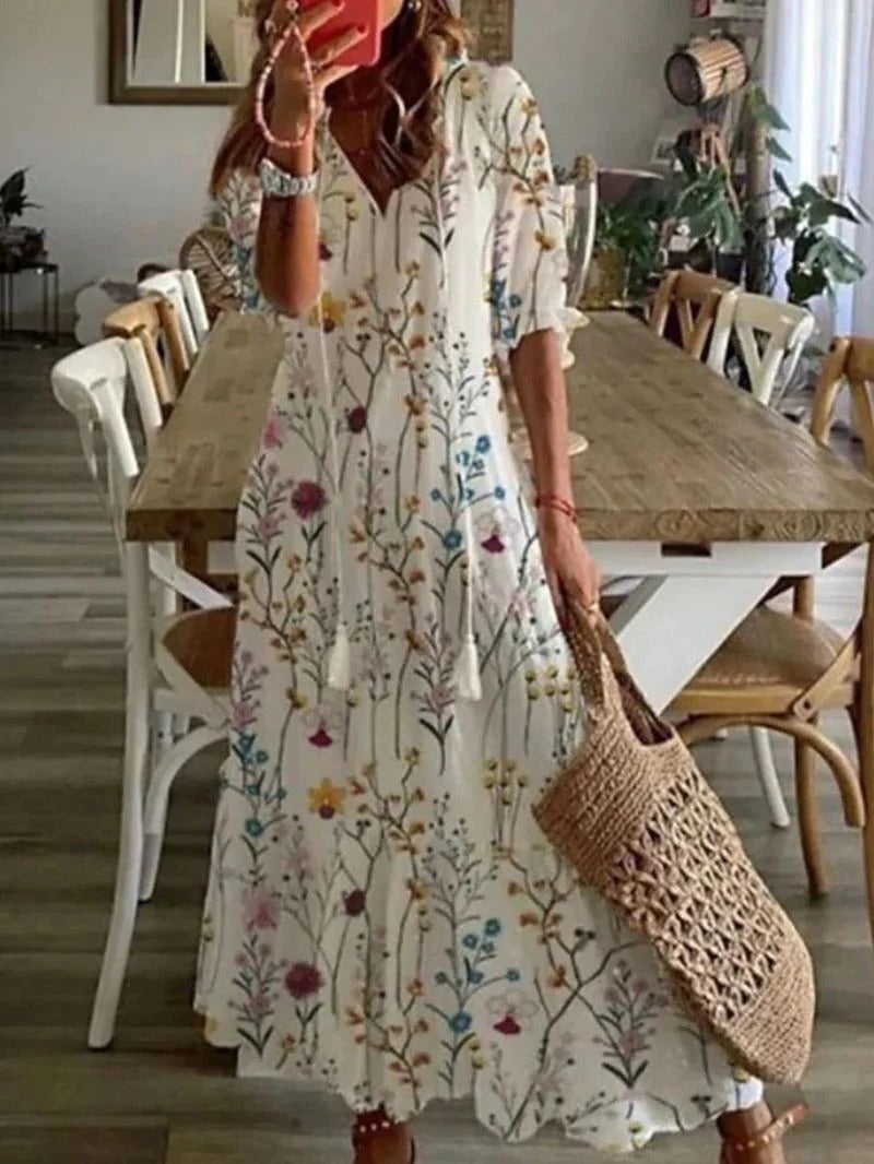 Elegant women's printed half-sleeve midi summer dress, ideal for beach, day, or evening wear.