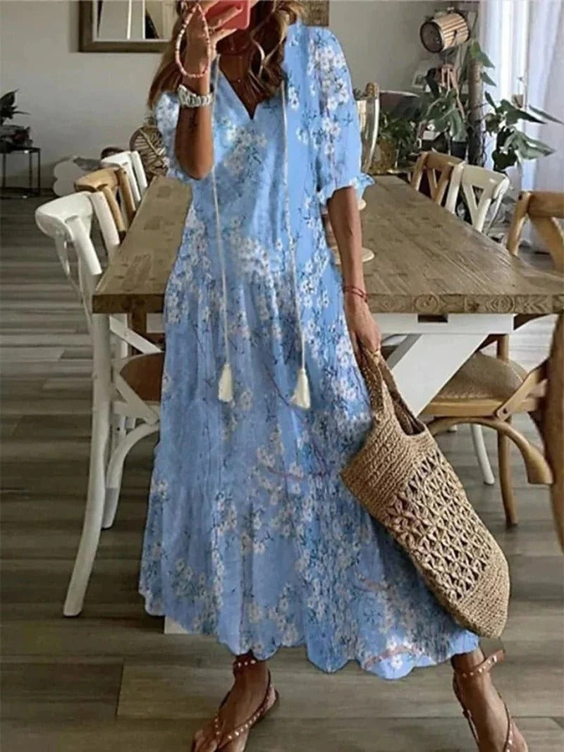 Comfortable women's printed summer dress with half sleeves, a stylish and airy midi for warm days.