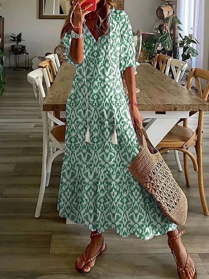 Vibrant women's printed summer midi dress with half sleeves, a stylish choice for any casual outing.