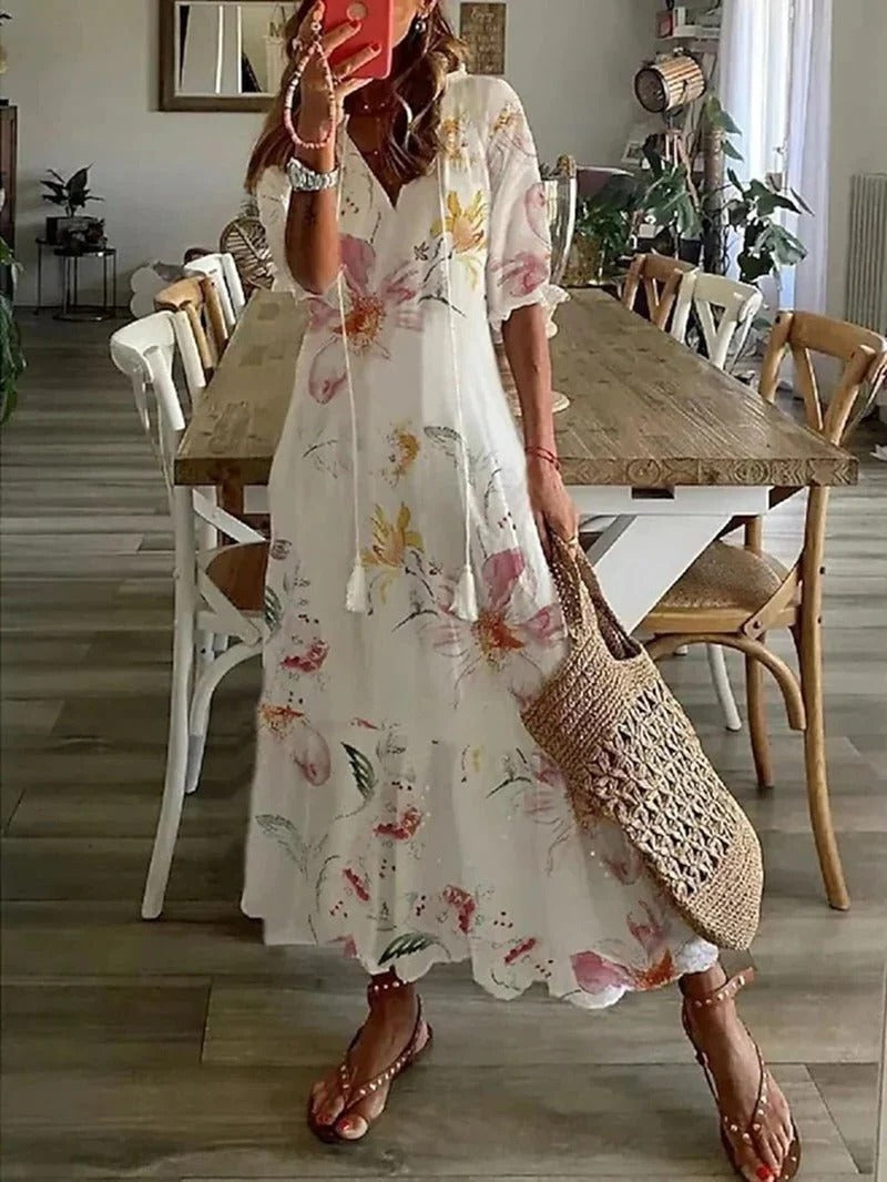 Fashionable women's printed summer dress with half sleeves, a versatile midi for vacation & casual style.