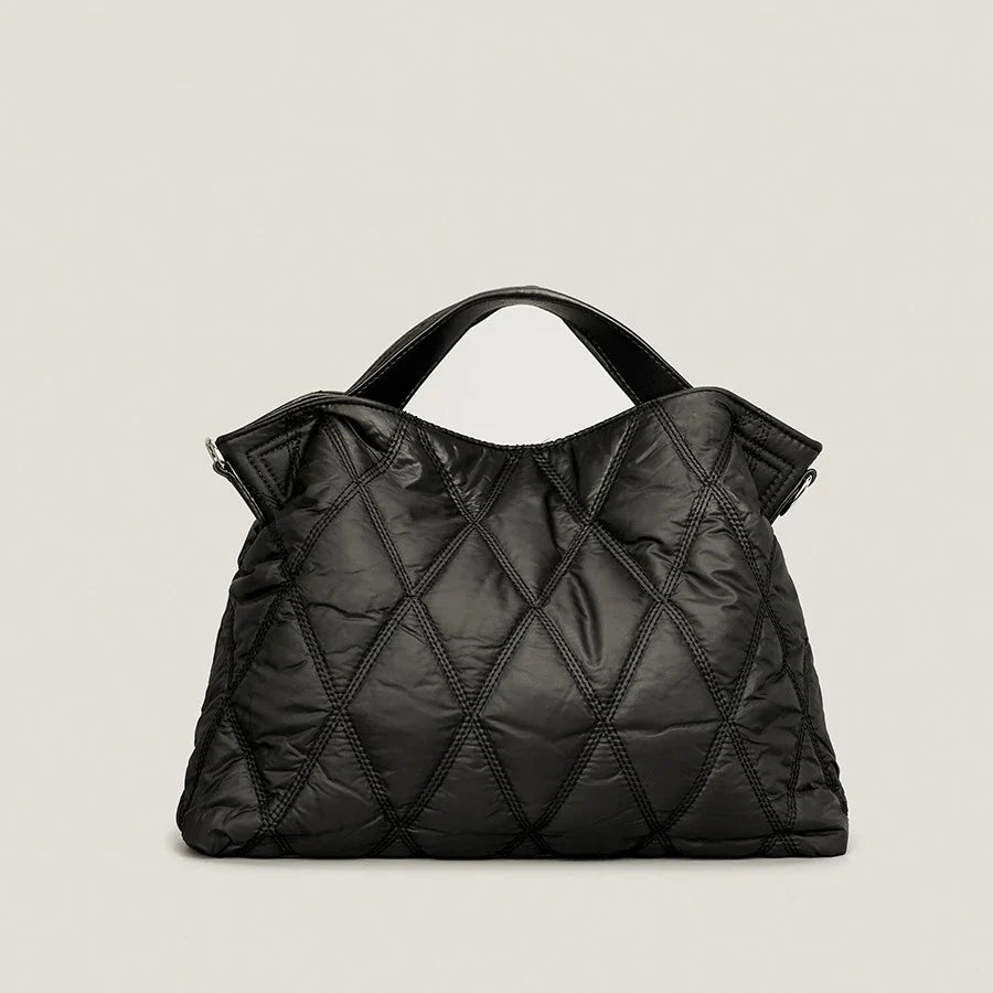 Stylish women's quilted tote bag, perfect for everyday carry. Spacious shoulder bag with a luxury feel.