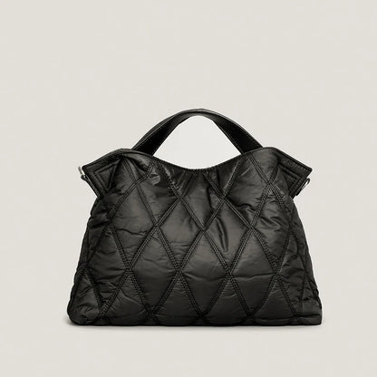 Stylish women's quilted tote bag, perfect for everyday carry. Spacious shoulder bag with a luxury feel.