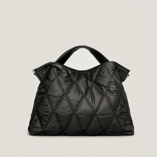 Stylish women's quilted tote bag, perfect for everyday carry. Spacious shoulder bag with a luxury feel.