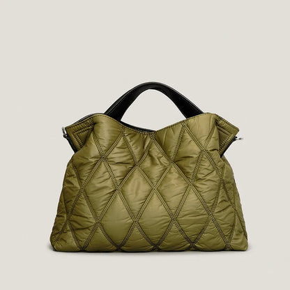 Fashionable women's quilted tote, ideal as a versatile shoulder bag. Elegant and spacious for daily use.