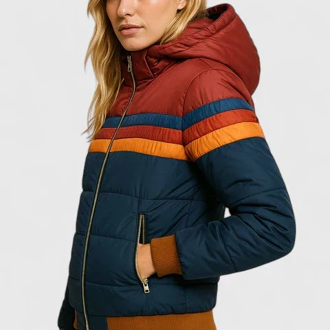 Model wearing a women's retro stripe warm winter jacket. Stylish casual outerwear for cold weather fashion.