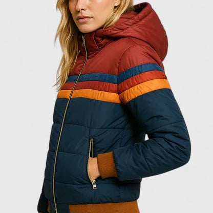 Model wearing a women's retro stripe warm winter jacket. Stylish casual outerwear for cold weather fashion.