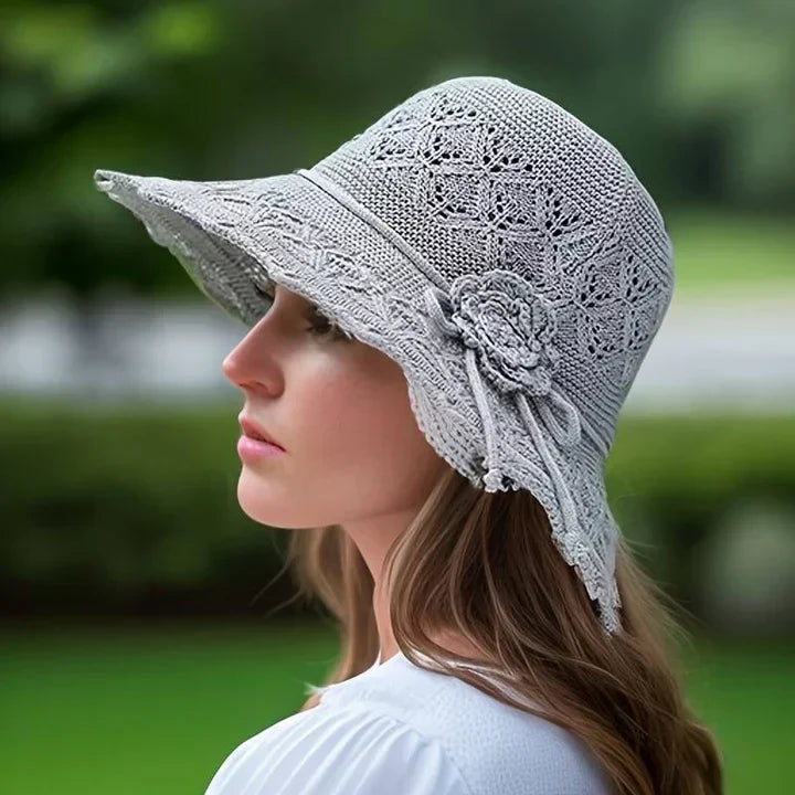Elegant lace sun hat for women, fashionable wide brim, ideal for beach and summer style.
