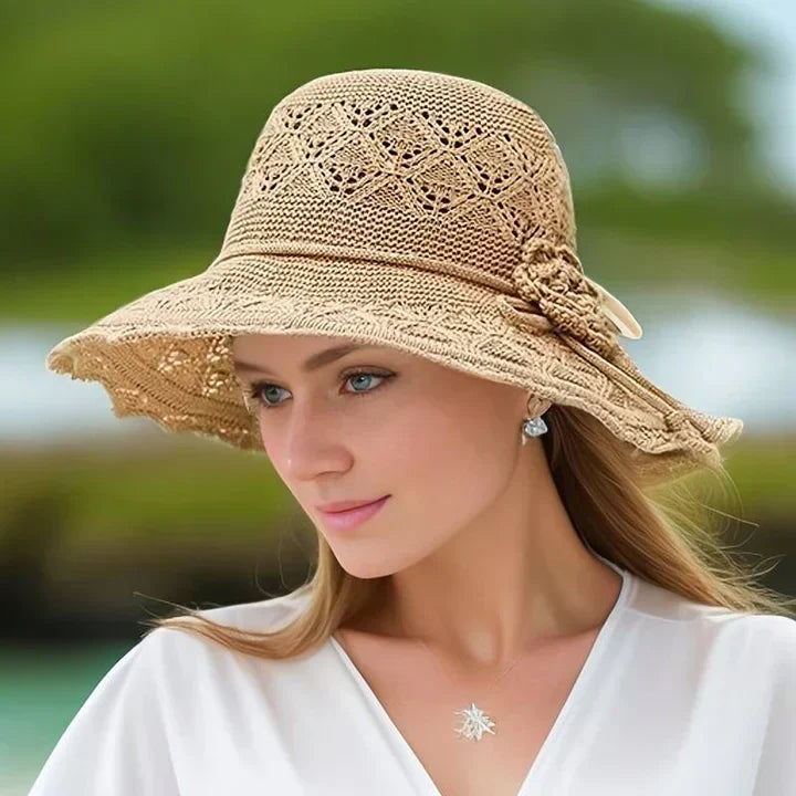 Foldable wide-brim sun hat for women with adjustable fit and stylish lace detail.