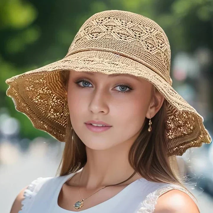 Women's stylish wide brim sun hat with elegant lace, perfect for summer fashion.