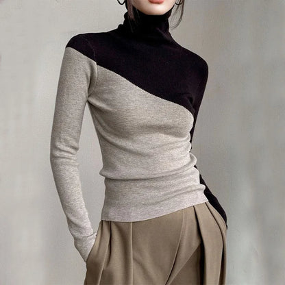 Modern women's long-sleeve knit top with a unique split color design, ideal for stylish fall and winter fashion.
