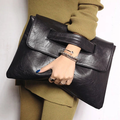 Stylish women's vegan leather shoulder handbag in black, perfect for everyday fashion and carrying essentials.