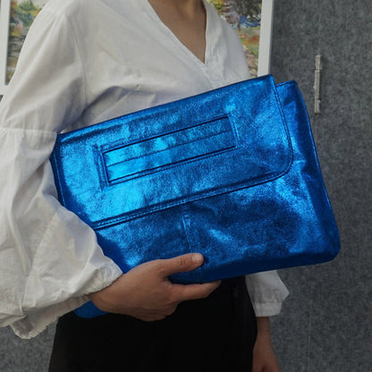 Open women's vegan leather handbag revealing spacious interior for phone, wallet, and daily fashion accessories.