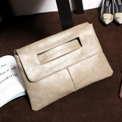 Versatile women's vegan leather bag worn as a crossbody, showcasing its adjustable strap and stylish design.