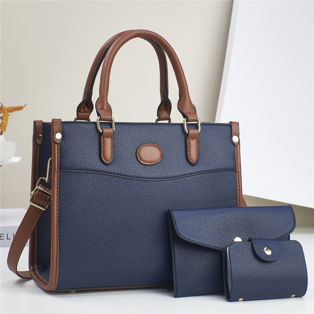 Elegant Verona Trio women's handbag set. Three versatile bags: tote, shoulder, and wallet for any occasion.