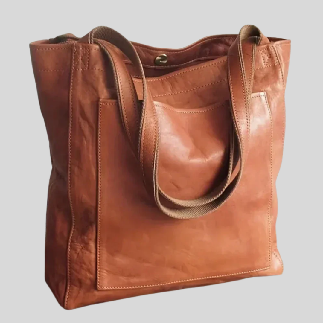 Stylish women's versatile tote bag with adjustable shoulder strap, perfect for daily carry & travel.