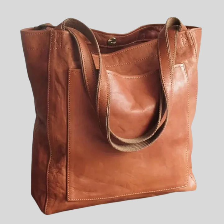 Stylish women's versatile tote bag with adjustable shoulder strap, perfect for daily carry & travel.