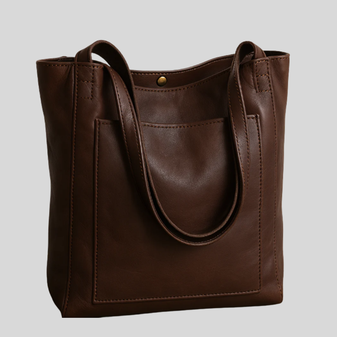 Modern women's tote bag for daily use, featuring strong handles & removable, adjustable shoulder strap.