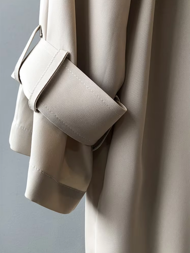 Fashionable women's waterproof double-breasted trench coat. A weather-ready classic for women's style.