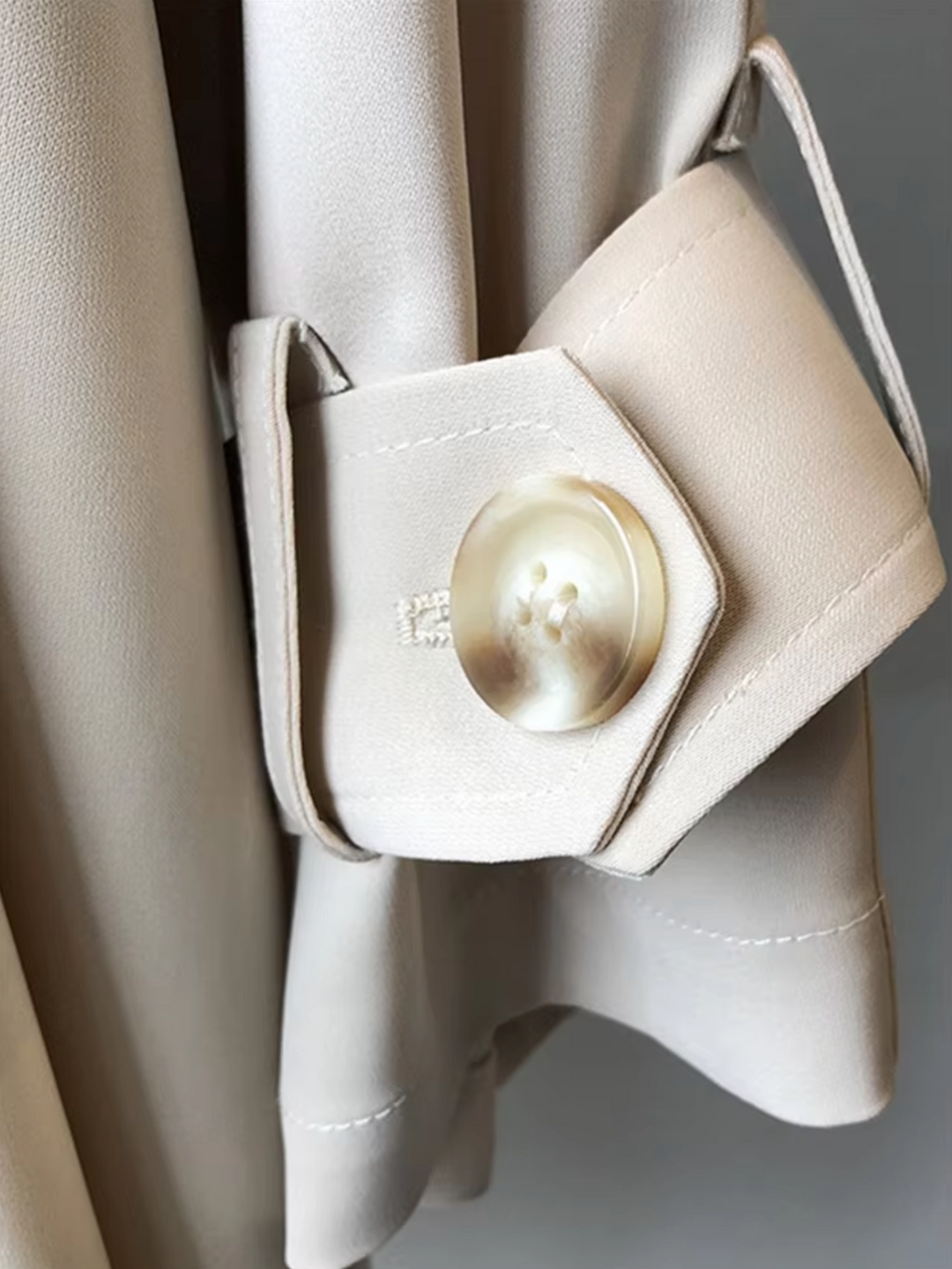 Sophisticated women's waterproof double-breasted trench coat. Stylish outerwear for fall & spring fashion.