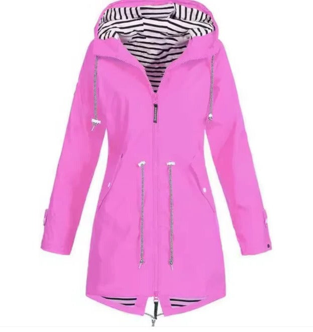 Close-up of a women's sleek waterproof hooded jacket, highlighting its durable fabric & stylish design for weather protection.