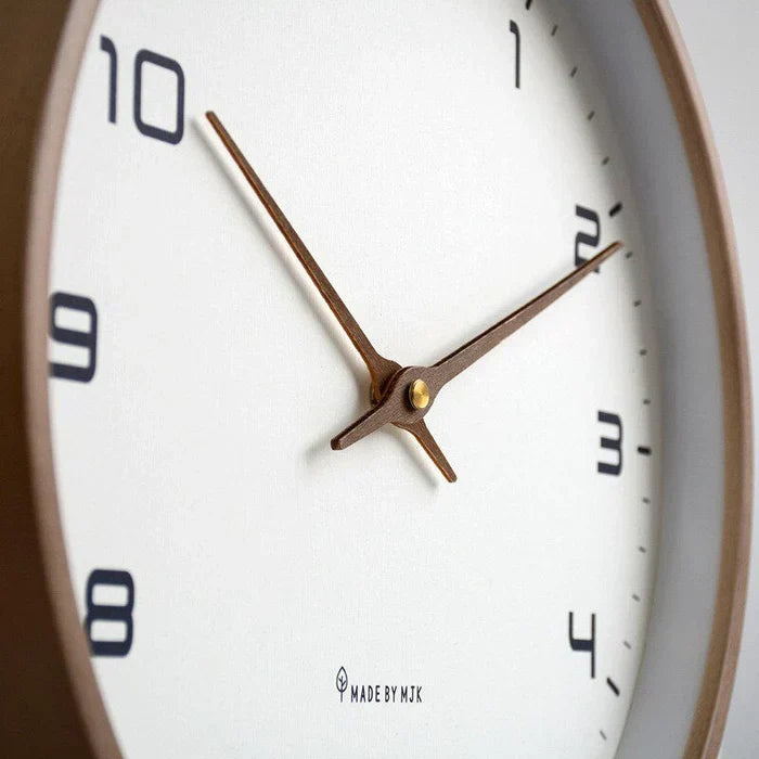 Modern wooden wall clock, versatile for home & office decor, features a minimalist natural wood design.