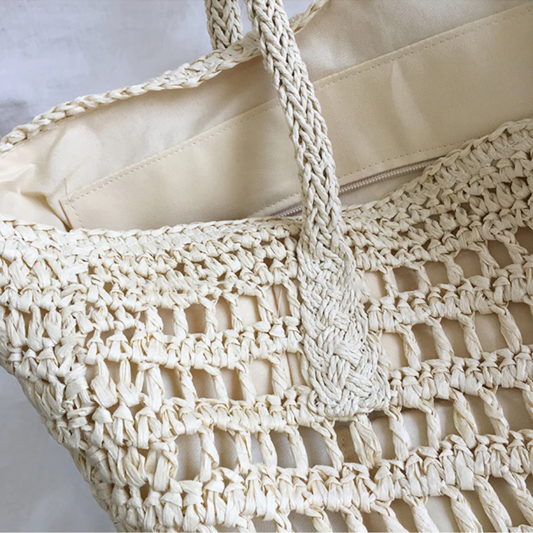 Chic brown woven shoulder tote bag for women, stylish & spacious for summer outings.