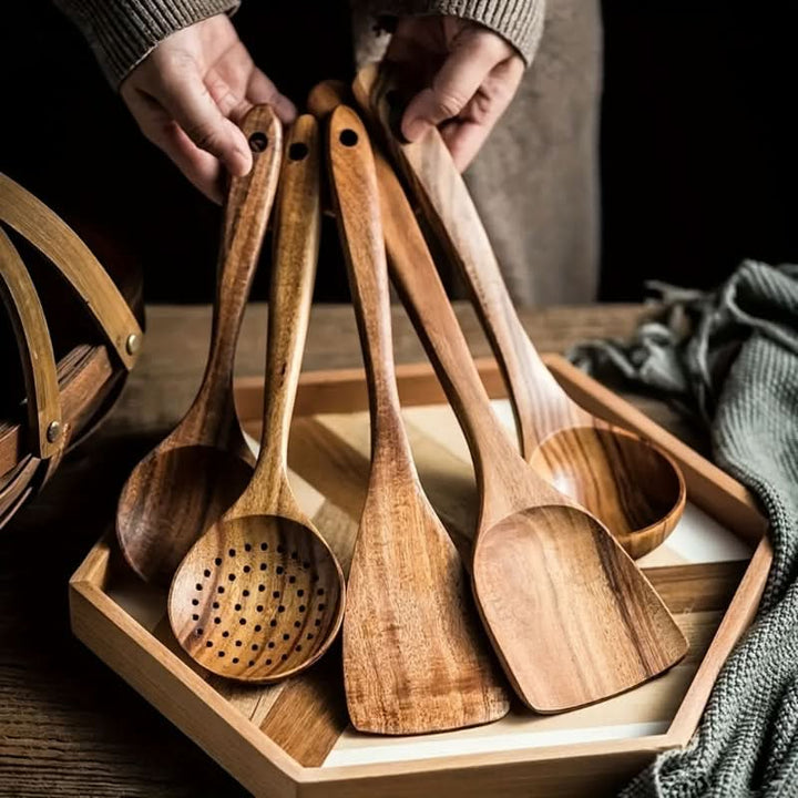 Sustainable Teak Cooking Utensil Set. Natural wood kitchen tools for eco-friendly cooking. Spatula, spoon, turner.