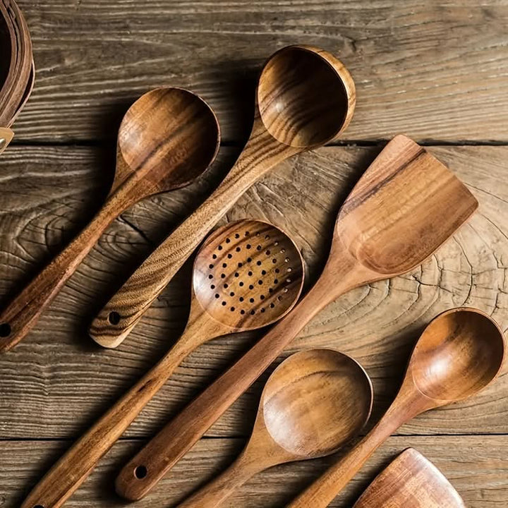 Natural wood teak kitchen utensil set. Durable and sustainable spatula, spoon, and turner for daily cooking.