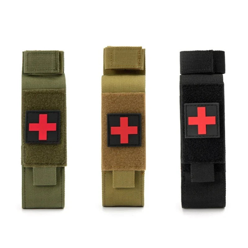Tactical black nylon tourniquet holder pouch with MOLLE straps, ideal for first aid gear.