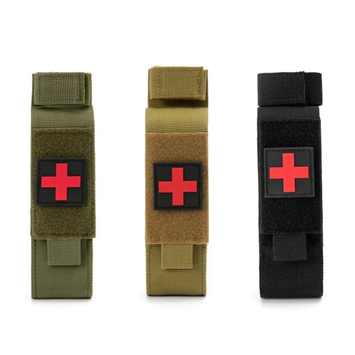 Tactical black nylon tourniquet holder pouch with MOLLE straps, ideal for first aid gear.