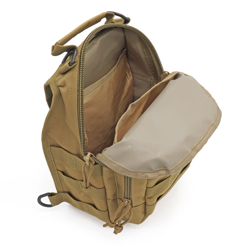 Close-up of the durable construction and MOLLE system on a black tactical military grade sling bag.