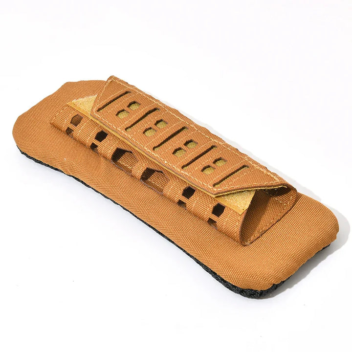 Detailed view of tactical shoulder pad's stitching and rugged nylon material for backpack durability.