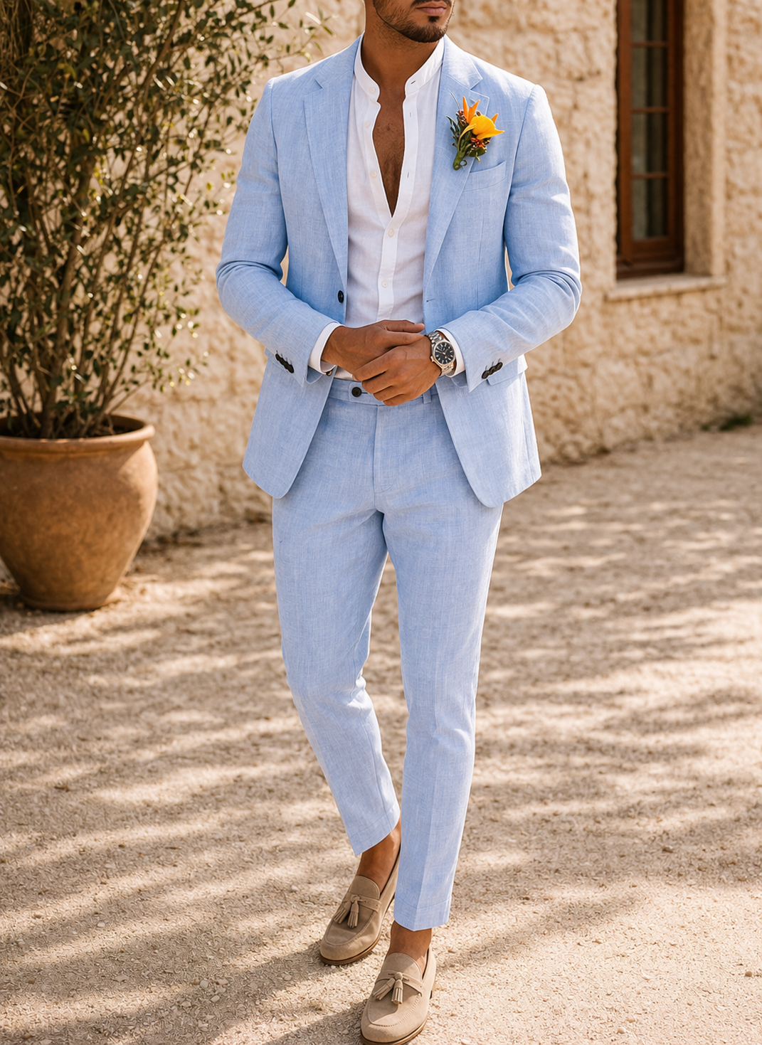Light blue tailored men's wedding suit. Stylish two-piece formal wear, ideal for summer events & grooms.