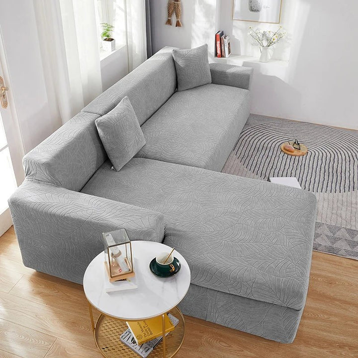 Stretch L-shape sectional cover, pet-friendly and washable, protecting your couch with ease.