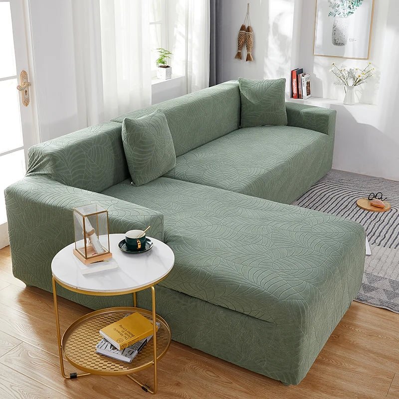 Elegant polyester L-shape sofa slipcover, a removable furniture protector for modern living rooms.