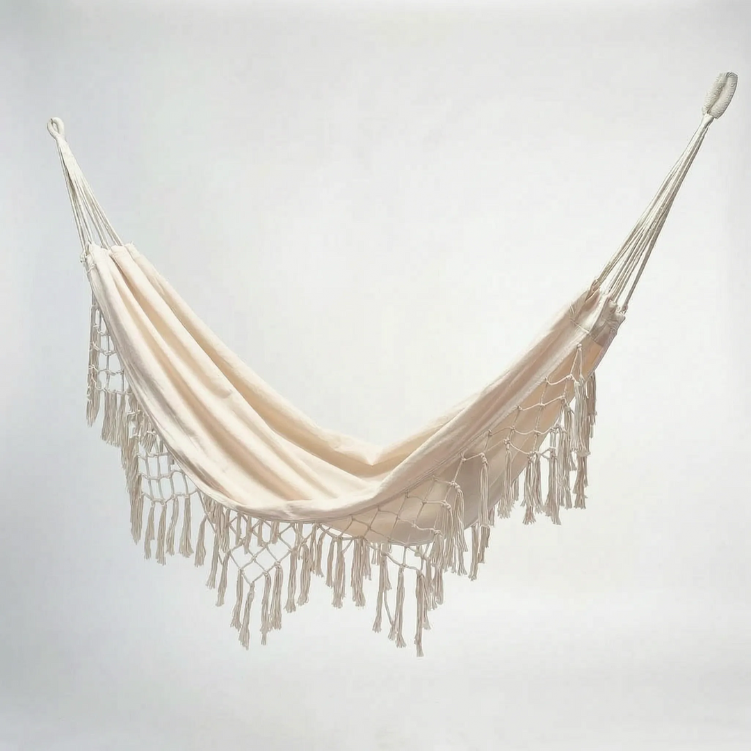 Relaxing tasseled hammock bed, ideal for outdoor living; bohemian style hanging chair for garden or patio.