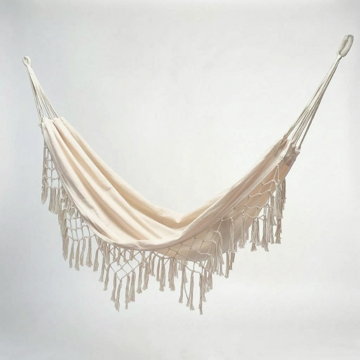 Relaxing tasseled hammock bed, ideal for outdoor living; bohemian style hanging chair for garden or patio.