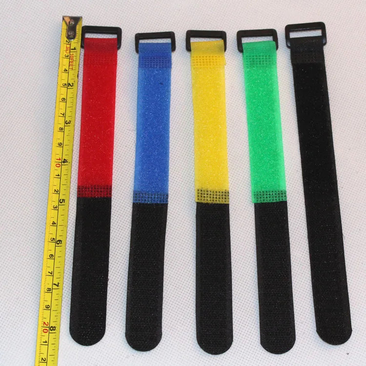 Close-up of a single black fishing rod tie strap with hook and loop closure, fishing accessory